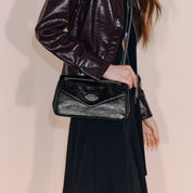 Black Embossed Flap Crossbody Bags