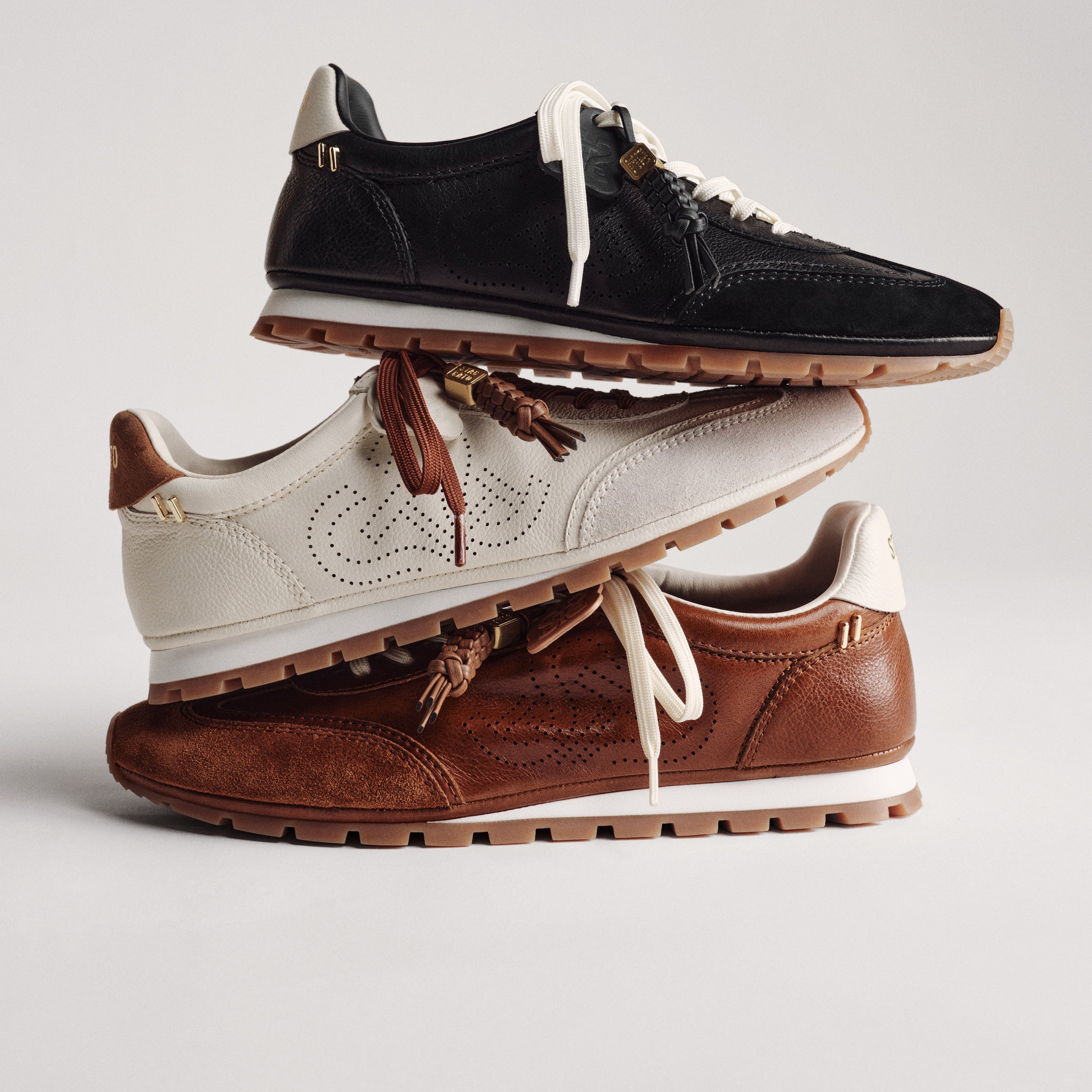 Perforated ST Logo Suede Patchwork Flat Sneakers